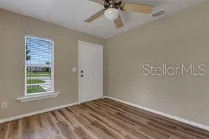 a view of an empty room with a window
