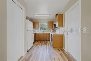 a bathroom with a sink a mirror and a bathtub