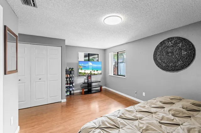 a bedroom with a bed and a chair