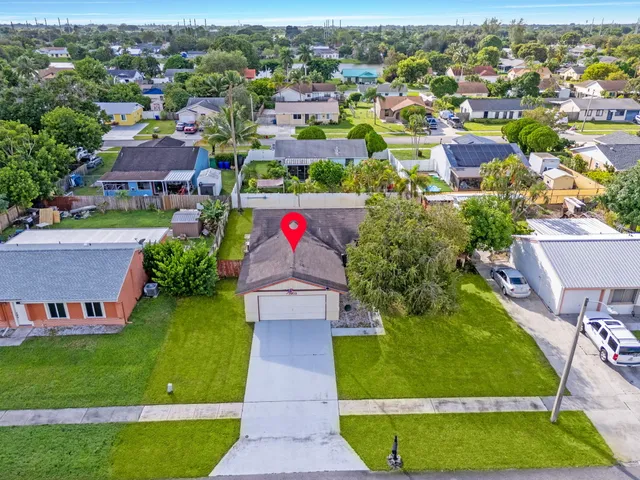 an aerial view of a house with a garden