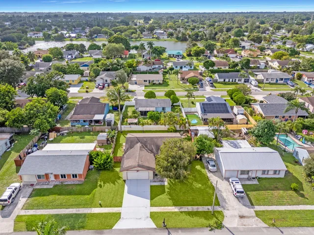 an aerial view of a house with a garden