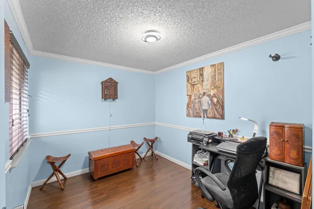 a workspace with furniture and wooden floor