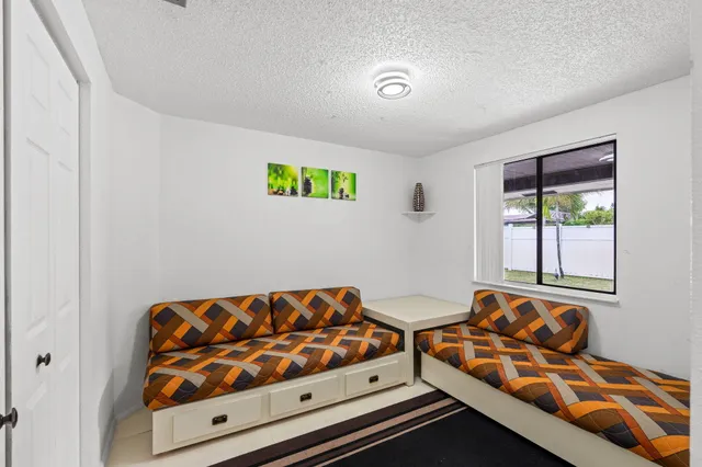 a bedroom with bed and window