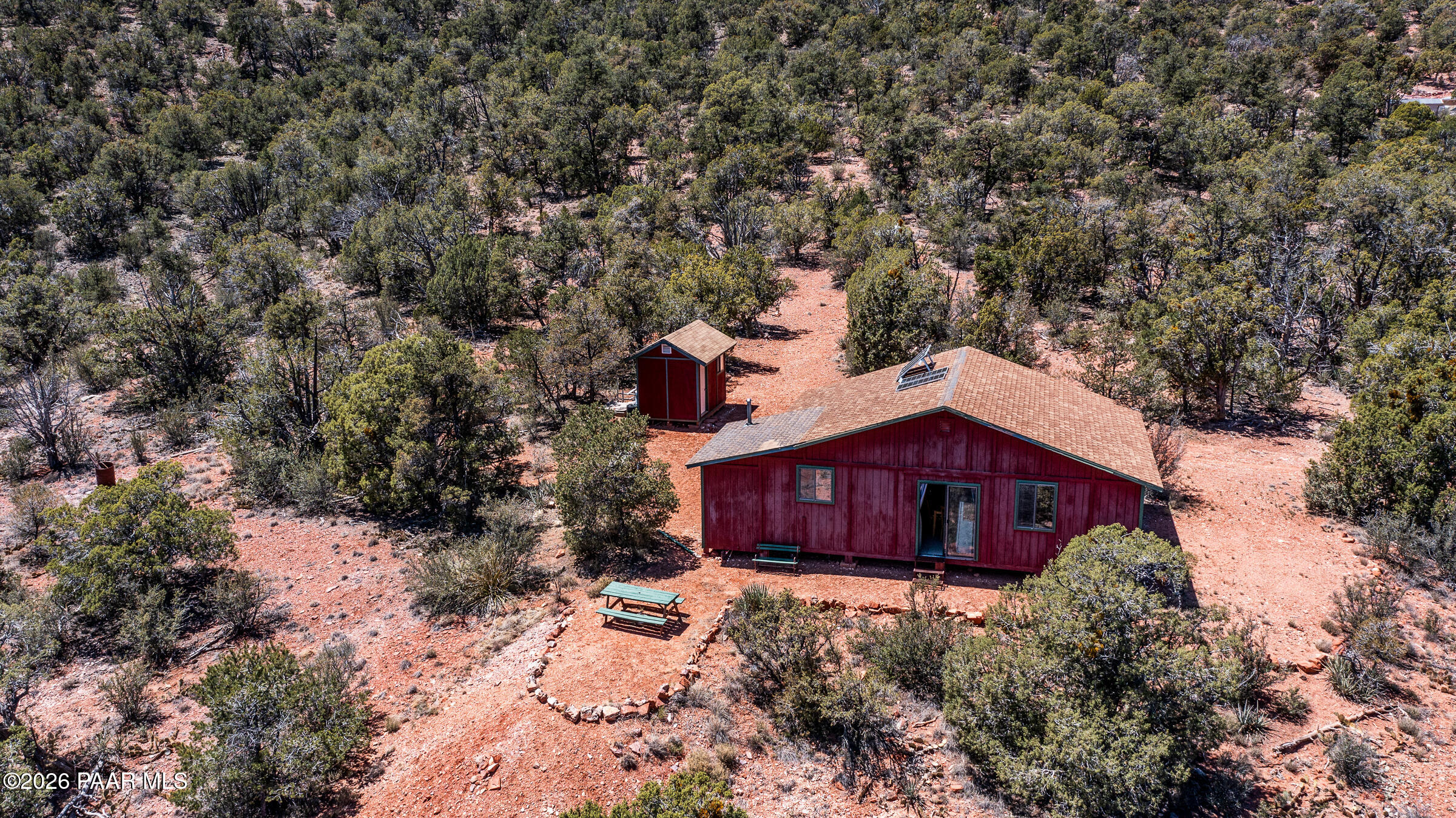 33749 West Whiskey River Road, Unit 21 Seligman, AZ 86337 - Photo 1 of 41 a large tree in front of a house