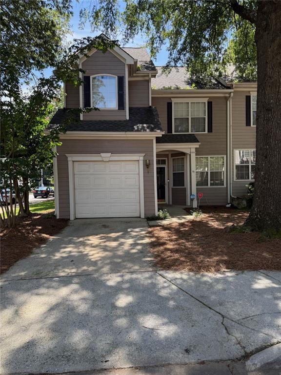 61 Hammock Place Southeast Atlanta, GA 30312 - Photo 1 of 12 a front view of a house with a garden