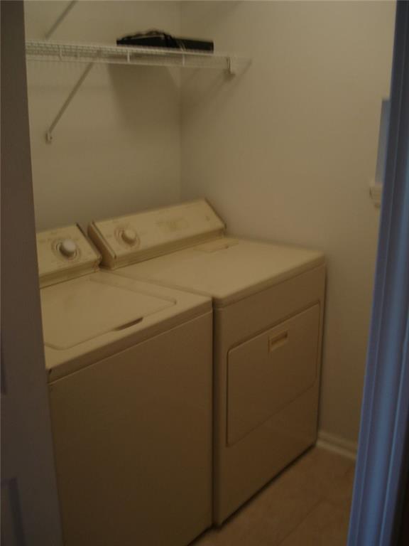 61 Hammock Place Southeast Atlanta, GA 30312 - Photo 10 of 12 a utility room with dryer and washer