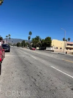 a view of a road with a building in the background