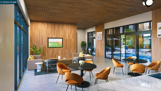 a living room with furniture and a floor to ceiling window