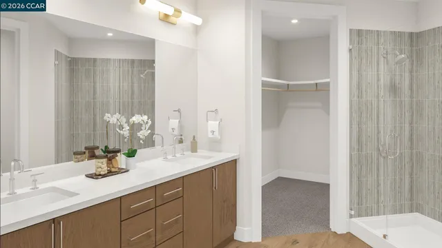 a bathroom with a double vanity sink and mirror