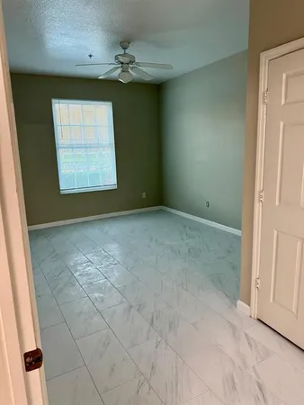 a bathroom with a toilet sink vanity and mirror