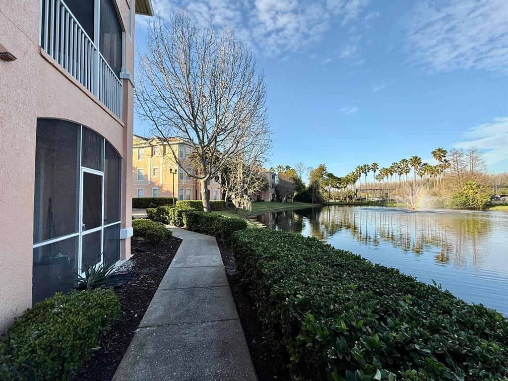 13572 Turtle Marsh Loop, Unit 212 Orlando, FL 32837 - Photo 18 of 20 a view of a pathway with a lake view