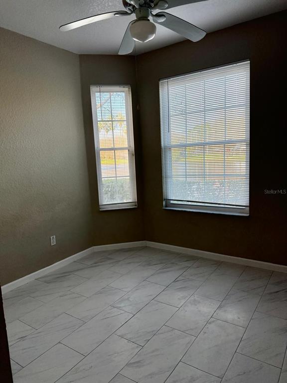 13572 Turtle Marsh Loop, Unit 212 Orlando, FL 32837 - Photo 9 of 20 an empty room with a window