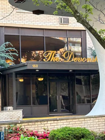 a view of a wooden door of the house