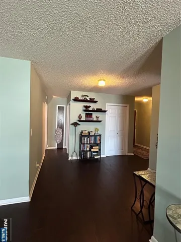a view of a livingroom with a chair and a fireplace