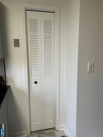 a view of a room that has a window in it