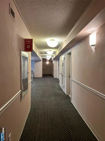a view of a hallway with stairs