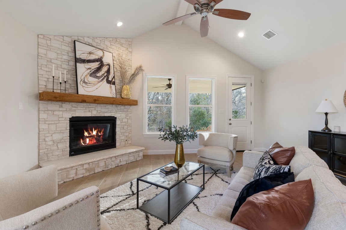 3223 Tamy Lane Brenham, TX 77833 - Photo 16 of 50 a living room with furniture a rug and a fireplace