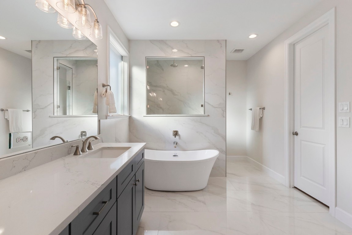3223 Tamy Lane Brenham, TX 77833 - Photo 28 of 50 a bathroom with a double vanity sink mirror and bathtub