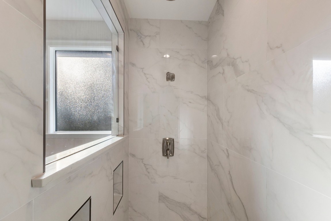 3223 Tamy Lane Brenham, TX 77833 - Photo 31 of 50 a bathroom with a glass shower door