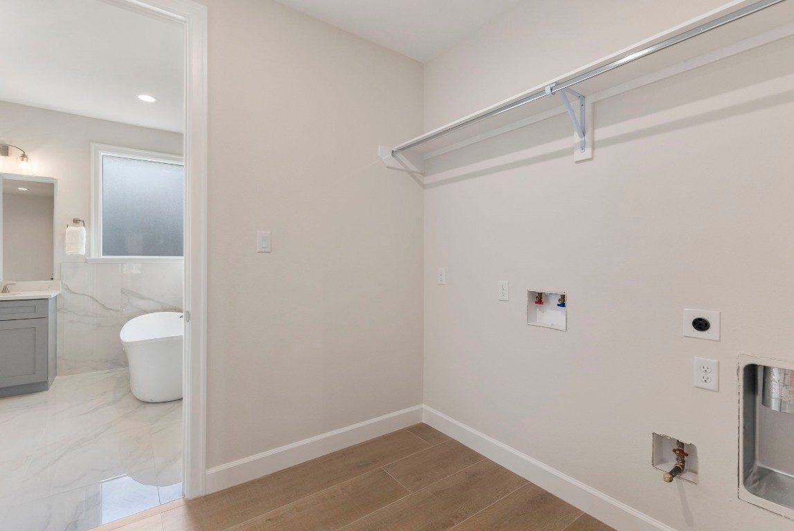 3223 Tamy Lane Brenham, TX 77833 - Photo 32 of 50 a bathroom with a sink and a toilet