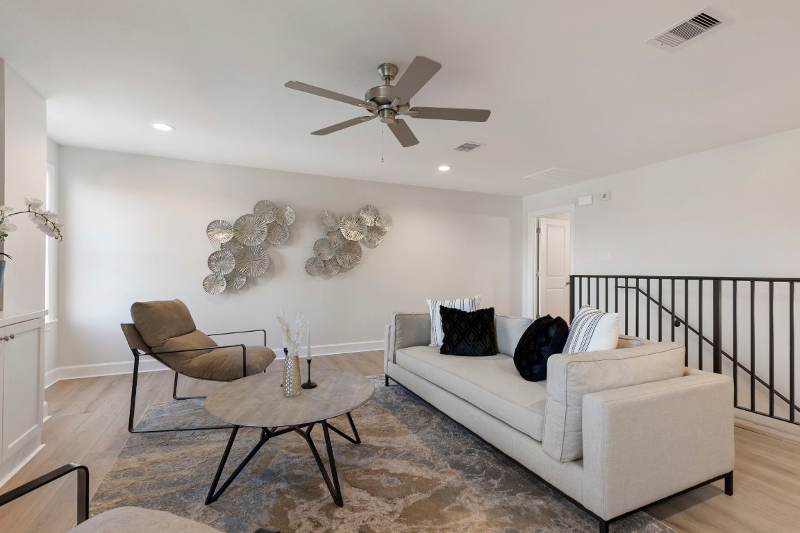 3223 Tamy Lane Brenham, TX 77833 - Photo 34 of 50 a living room with furniture and a wooden floor