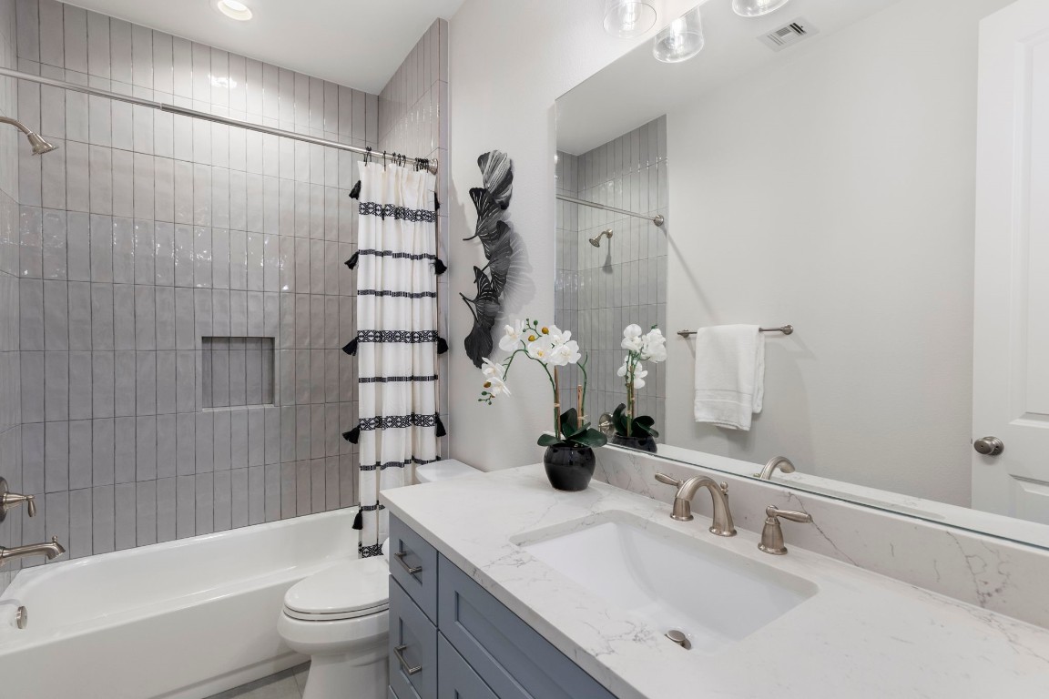 3223 Tamy Lane Brenham, TX 77833 - Photo 36 of 50 a bathroom with a sink toilet tub and shower