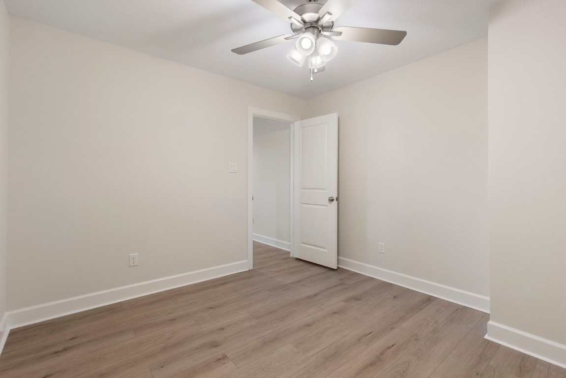 3223 Tamy Lane Brenham, TX 77833 - Photo 38 of 50 a view of an empty room with wooden floor