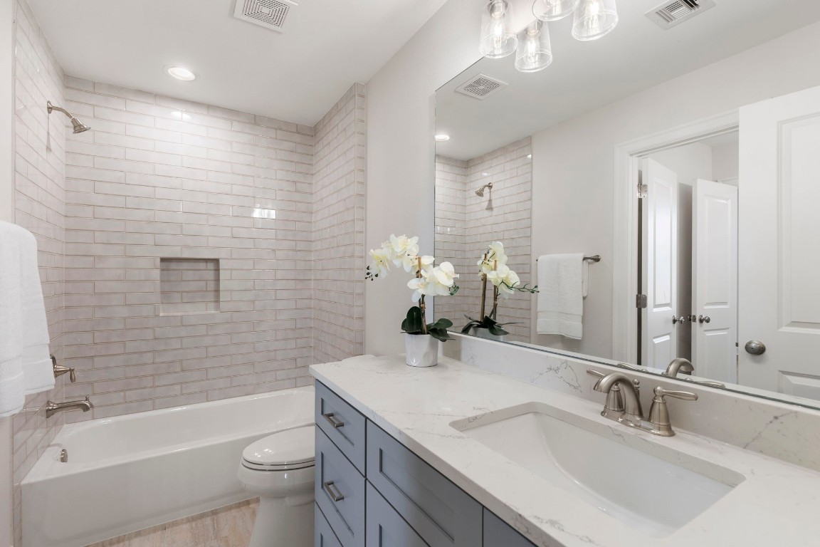 3223 Tamy Lane Brenham, TX 77833 - Photo 39 of 50 a bathroom with a sink a toilet and shower