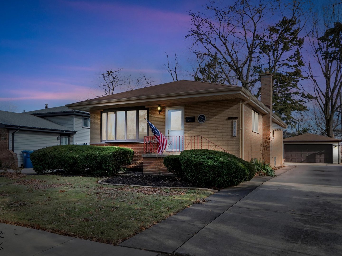 15043 Tripp Avenue Midlothian, IL 60445 - Photo 1 of 16 a front view of a house with garden