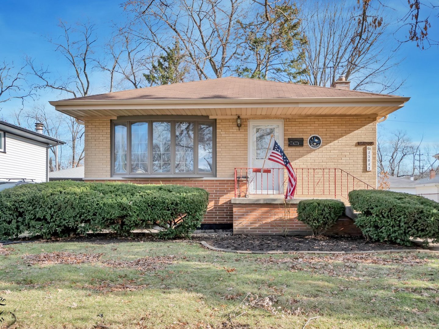 15043 Tripp Avenue Midlothian, IL 60445 - Photo 3 of 16 a front view of a house with garden