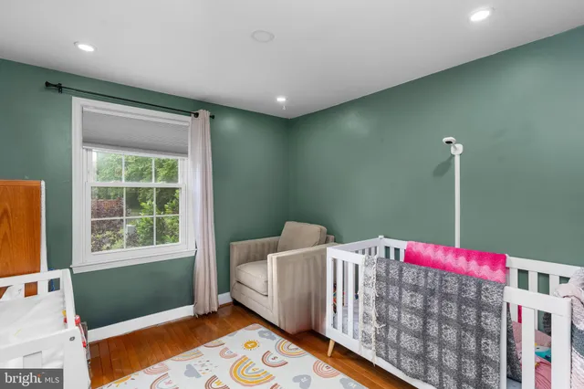 a bedroom with bed and a window