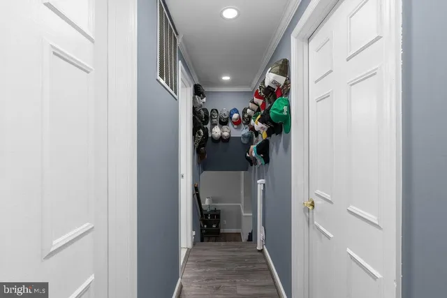 a view of a hallway with dining area