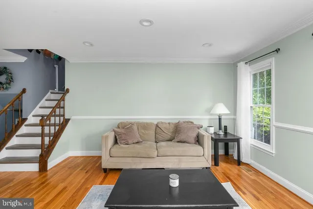 a living room with furniture and a rug