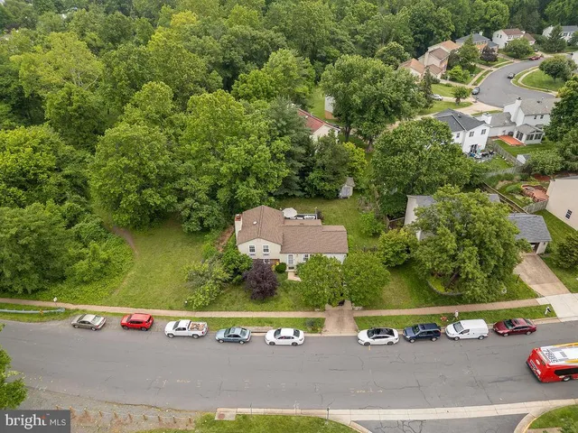 an aerial view of a house with a garden
