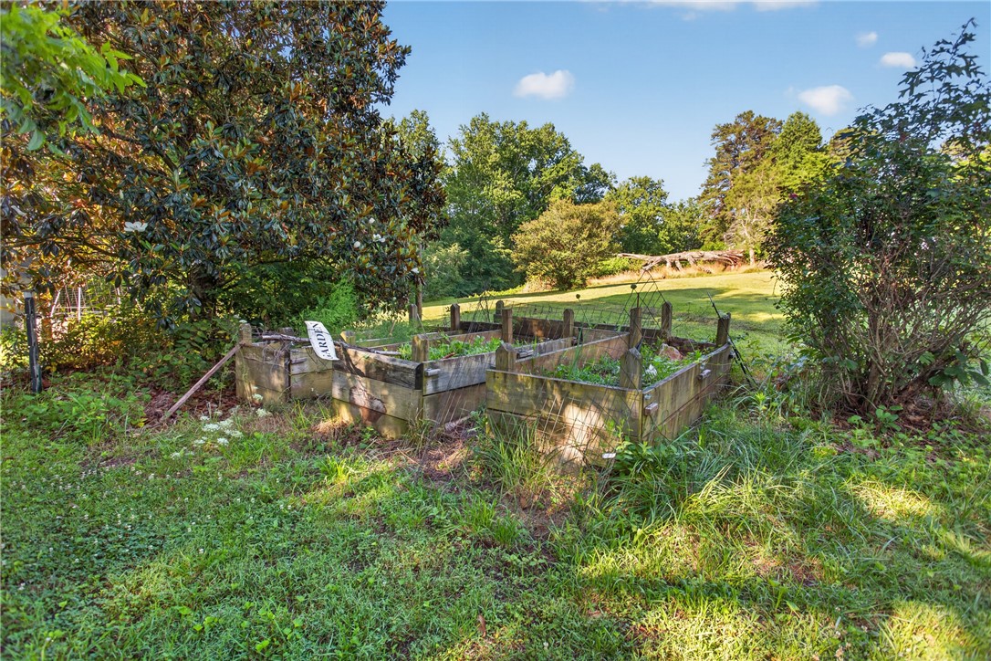 103 Dorsey Lane Walhalla, SC 29691 - Photo 36 of 42 Cultivate your green thumb with these dedicated raised garden beds, surrounded by mature trees.