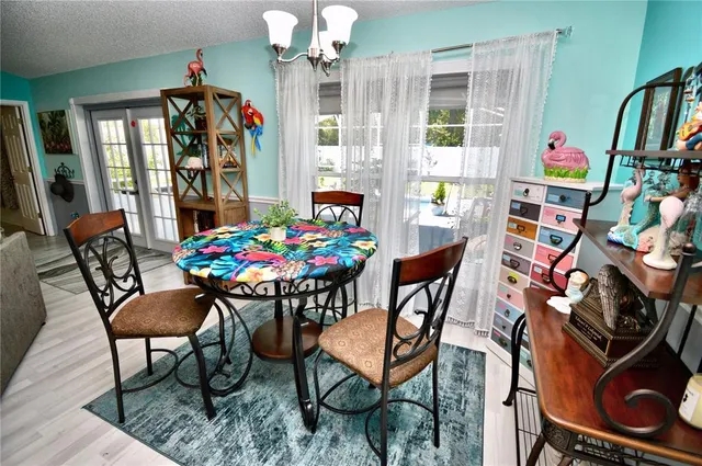 a bedroom with a bed a window and dresser