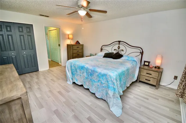 a view of walk in closet with clothes
