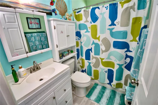 a bedroom with furniture and a flat screen tv