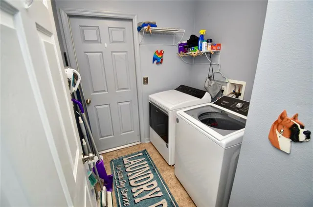 a view of living room with furniture and window