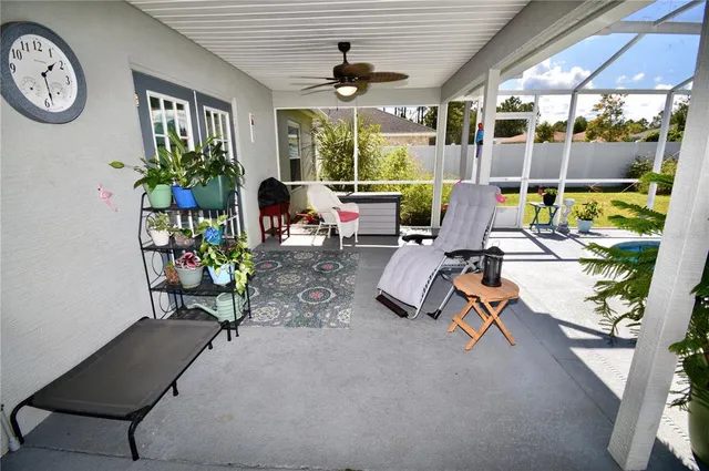 a view of a backyard with swimming pool