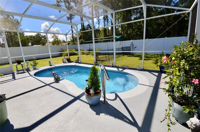a view of a backyard with sitting area