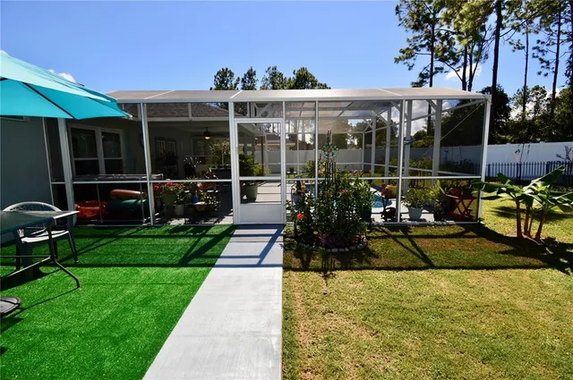a view of a swimming pool with a patio