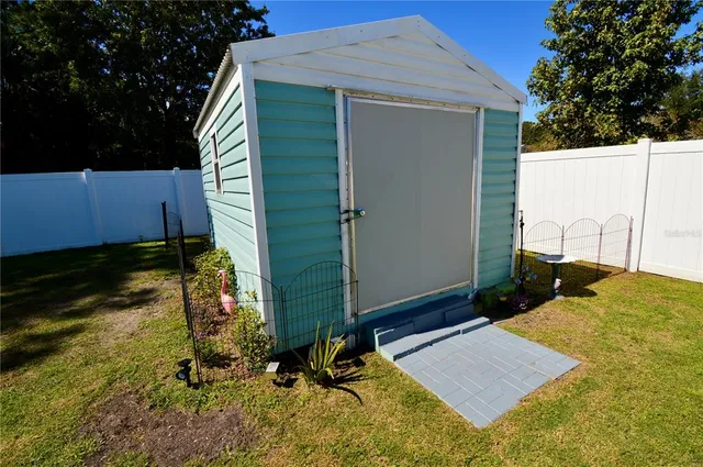 a swimming pool with some trees in the background