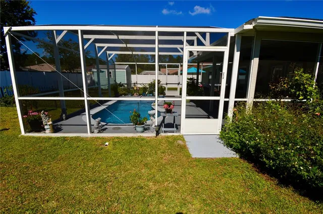 a view of a house with a swimming pool