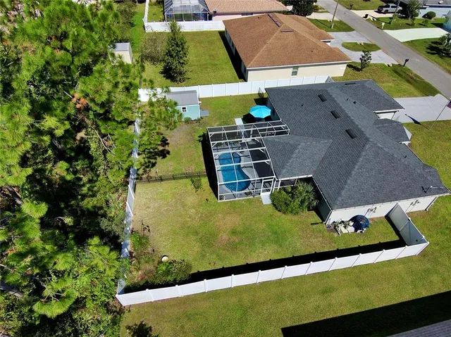an aerial view of a house with a garden