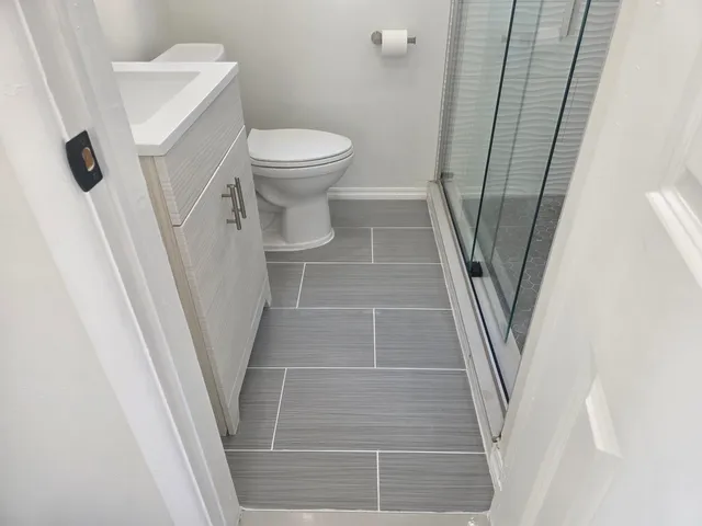 a bathroom with a toilet and a sink