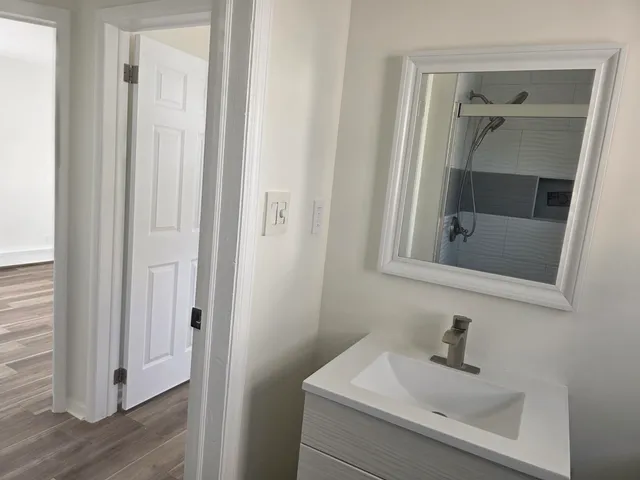 a bathroom with a sink and mirror