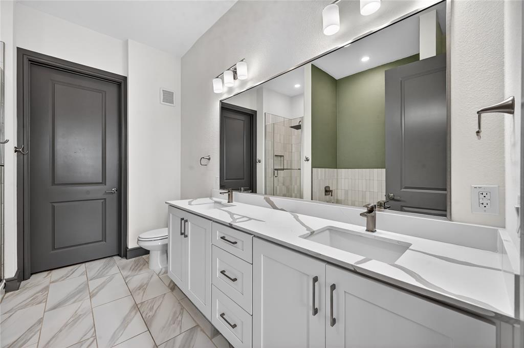 2700 Old Denton Road, Unit 2259 Carrollton, TX 75007 - Photo 23 of 39 a bathroom with a double vanity sink mirror and double