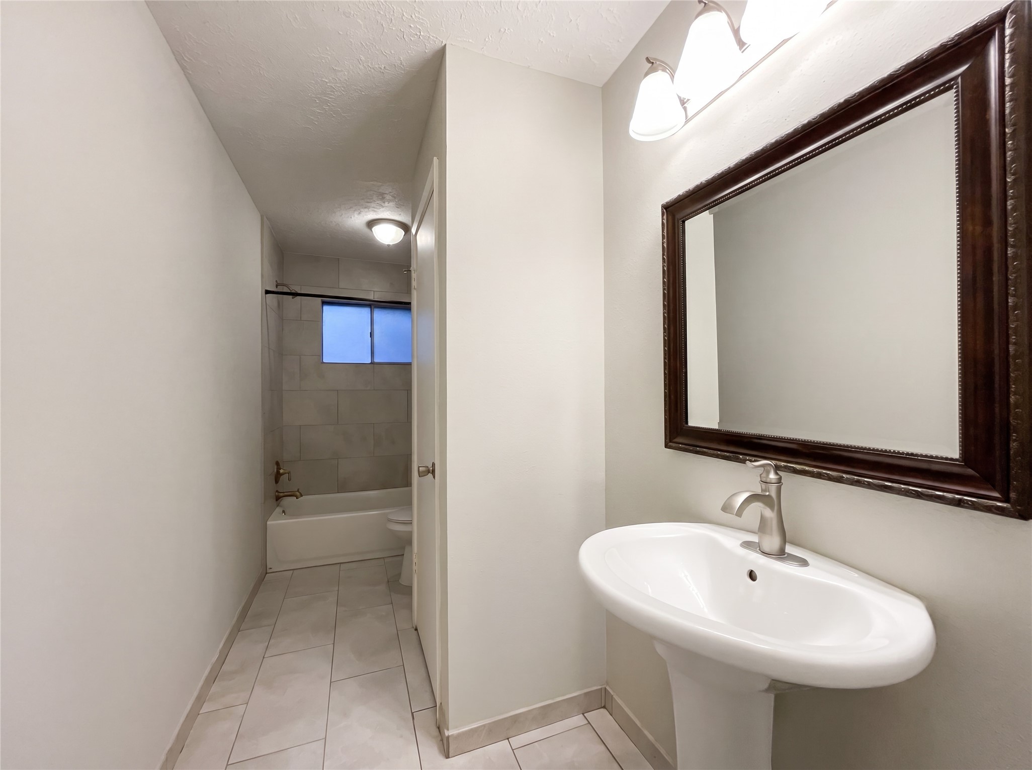 23110 Pennsgrove Road Spring, TX 77373 - Photo 12 of 16 a bathroom with a sink and mirror