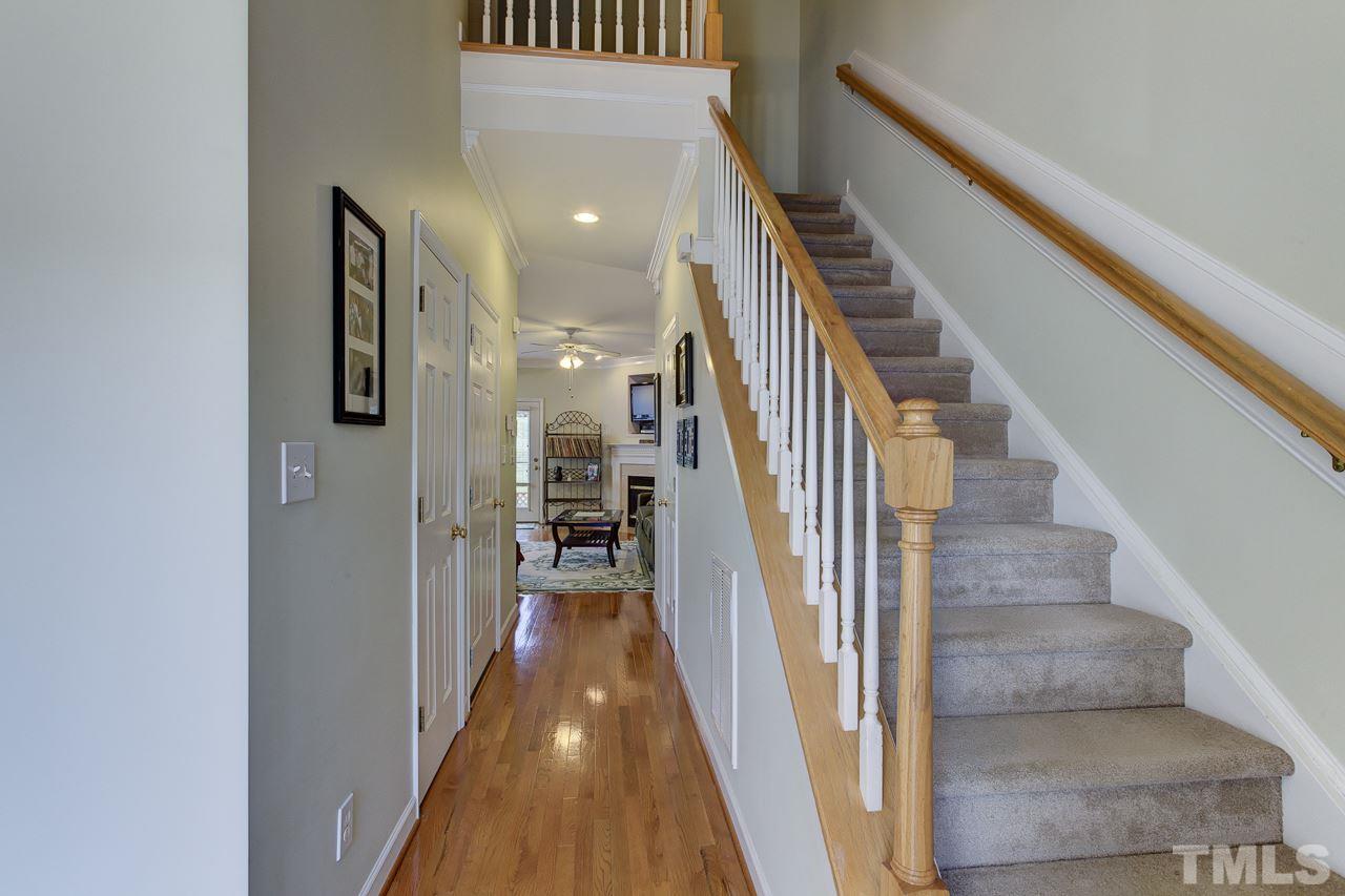 5410 Goldenglow Way Raleigh, NC 27606 - Photo 2 of 24 a view of entryway and gallery with wooden floor